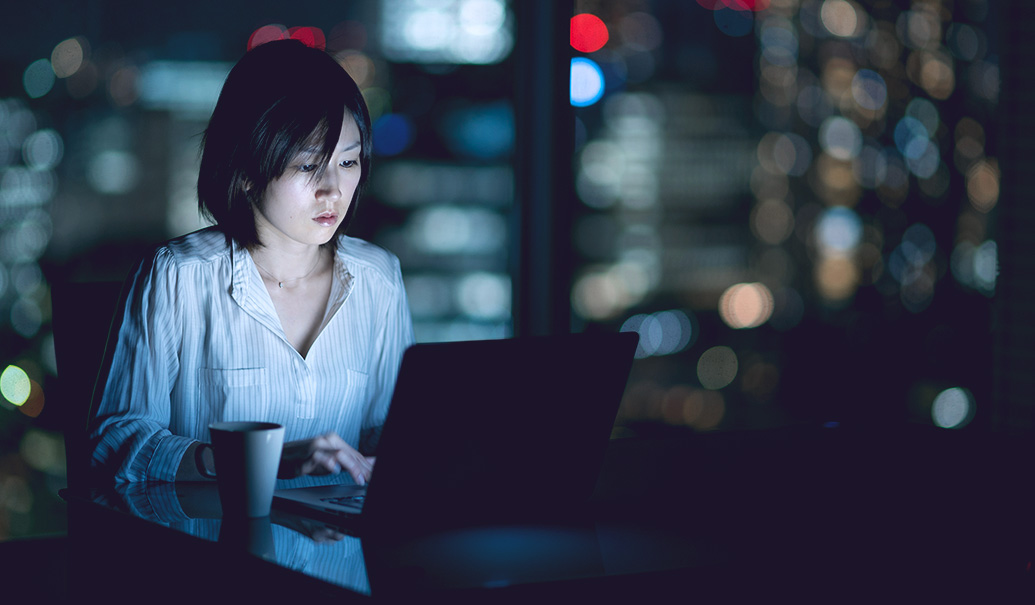 Woman working late at night